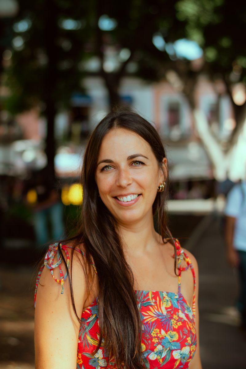 Woman smiling warmly outdoors