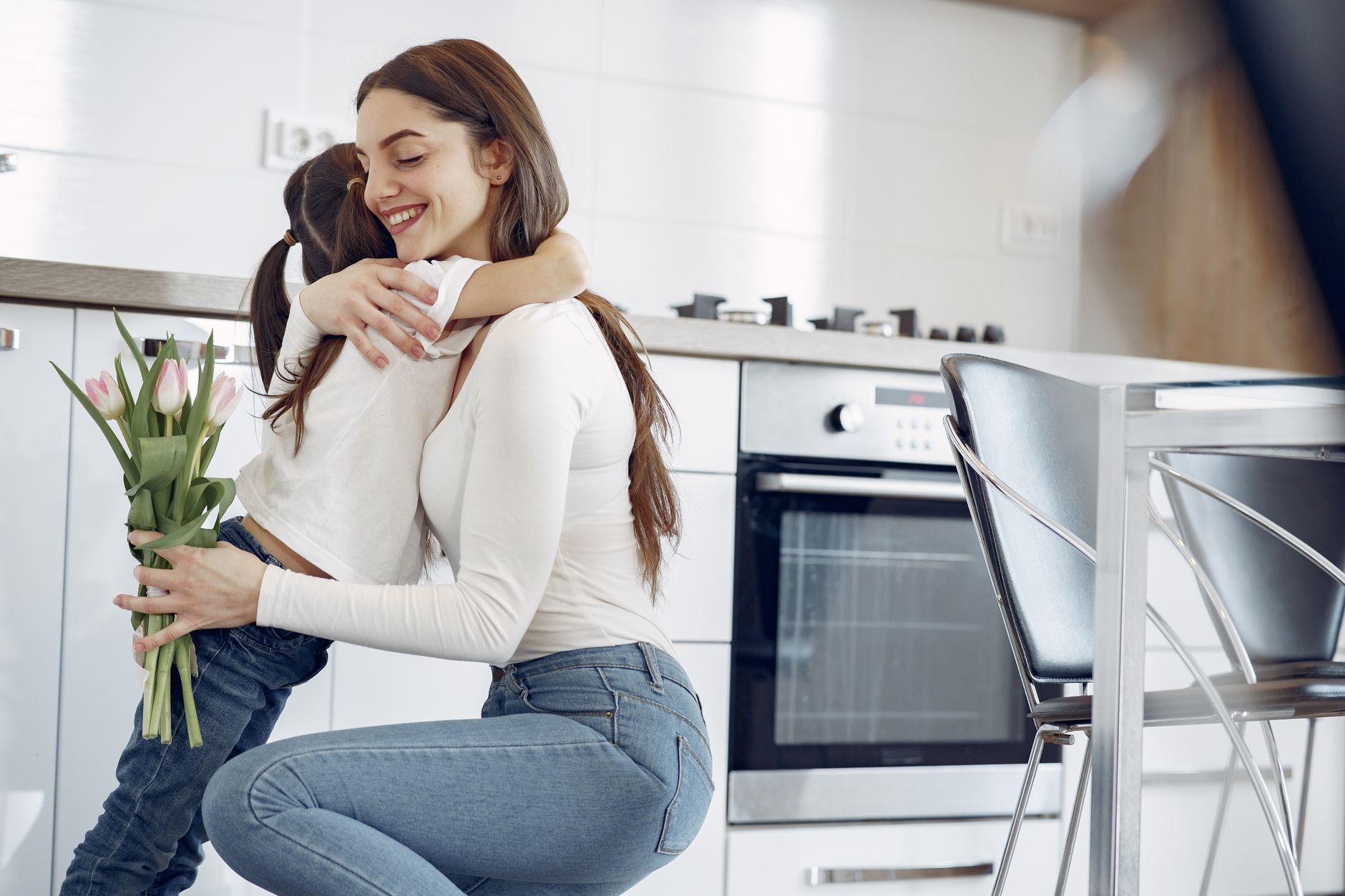 Mother hugging her daughter