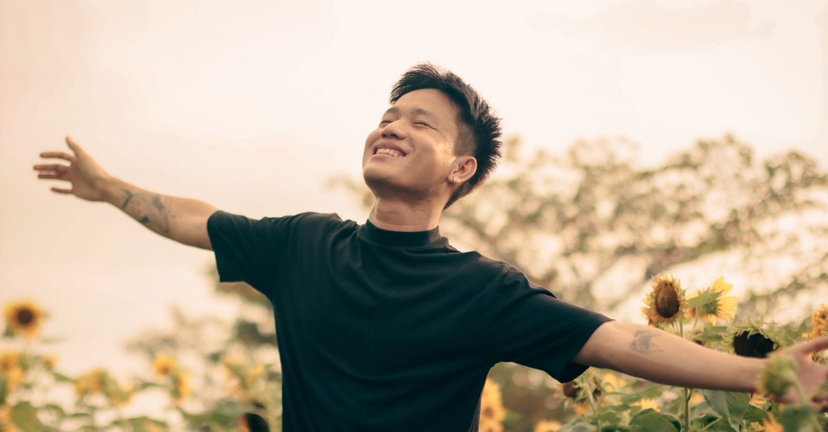 Man enjoying an open, sunny field